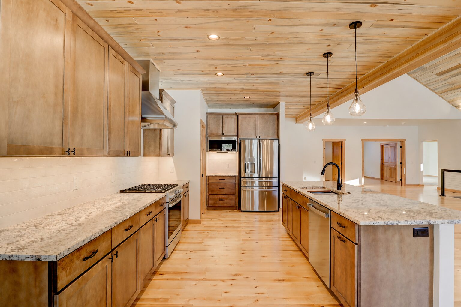 Custom kitchen with granite counters and knotty alder cabinets
