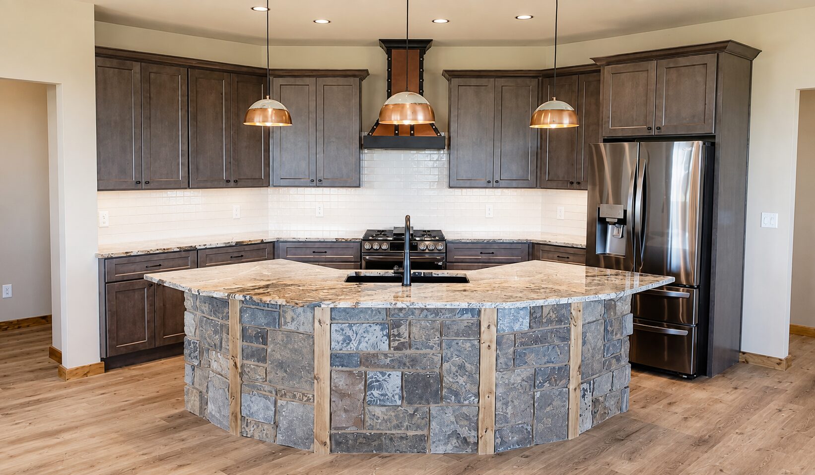 Custom kitchen with stone-wrapped island